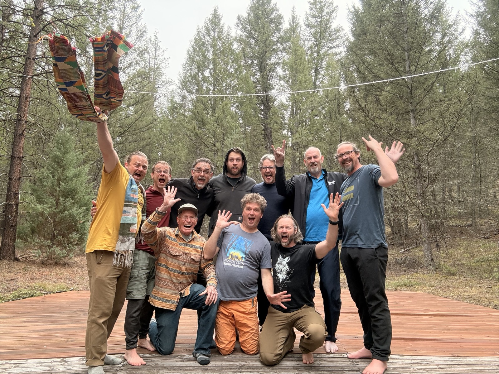 Men celebrating together at the Montana retreat